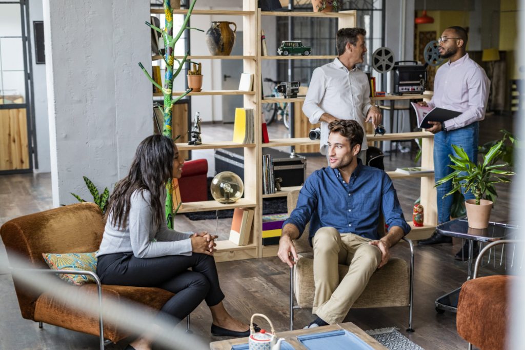 Business team having an informal meeting in loft office